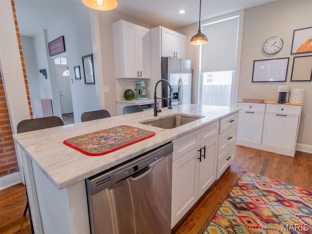 6454 Virginia Ave, Saint Louis, MO 63111 - kitchen featuring stainless steel appliances, wood finished floors, a kitchen island with sink, white cabinets, and recessed lighting
