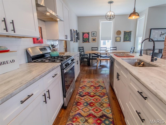 6454 Virginia Ave, Saint Louis, MO 63111 - kitchen with stainless steel appliances, wall chimney exhaust hood, dark wood-style floors, and backsplash