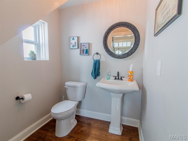 6454 Virginia Ave, Saint Louis, MO 63111 - bathroom with toilet and wood finished floors