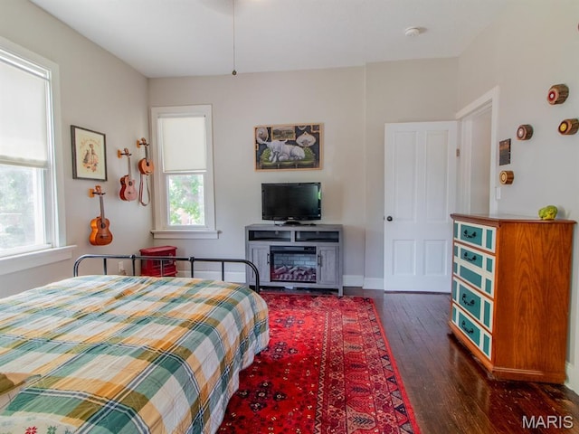 6454 Virginia Ave, Saint Louis, MO 63111 - bedroom with dark wood-type flooring and baseboards