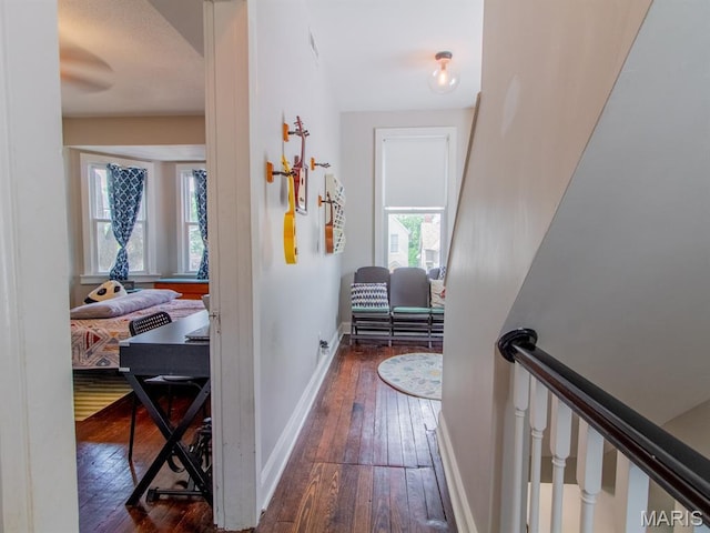 6454 Virginia Ave, Saint Louis, MO 63111 - hall featuring dark wood-style flooring and baseboards