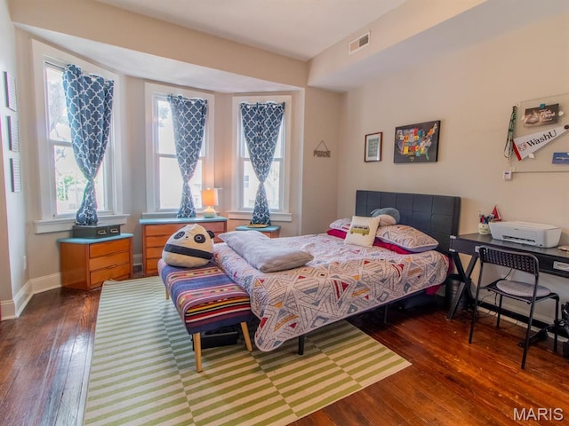 6454 Virginia Ave, Saint Louis, MO 63111 - bedroom with wood-type flooring and multiple windows