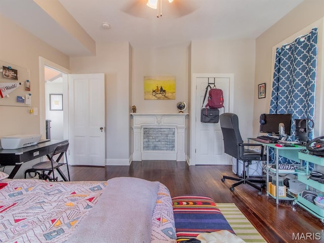6454 Virginia Ave, Saint Louis, MO 63111 - bedroom featuring wood finished floors, a fireplace, and a desk
