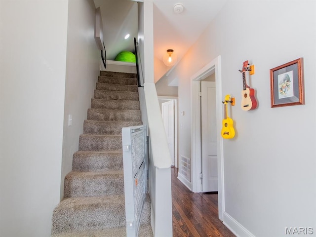 6454 Virginia Ave, Saint Louis, MO 63111 - staircase with wood finished floors and baseboards