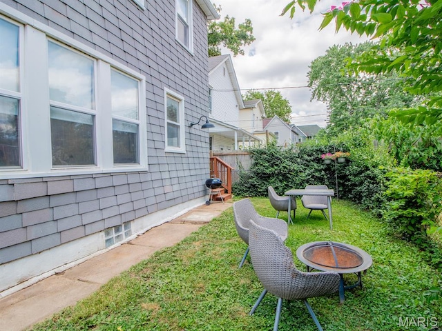 6454 Virginia Ave, Saint Louis, MO 63111 - view of yard featuring a fire pit