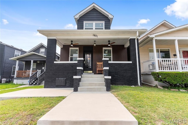 1821 Edwardsville Rd, Madison, IL 62060 - view of front of home featuring a porch, a ceiling fan, and a front yard