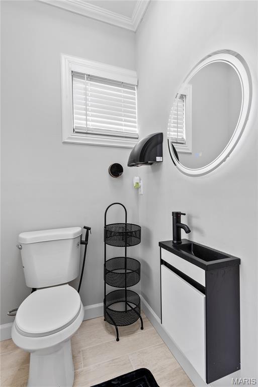 1821 Edwardsville Rd, Madison, IL 62060 - bathroom featuring crown molding and vanity