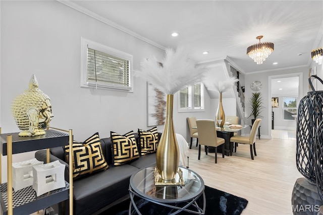 1821 Edwardsville Rd, Madison, IL 62060 - living room with a chandelier, healthy amount of natural light, recessed lighting, light wood-style floors, and crown molding