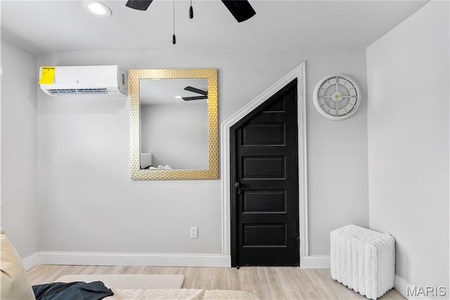1821 Edwardsville Rd, Madison, IL 62060 - bedroom with a wall mounted AC, wood finished floors, radiator, ceiling fan, and recessed lighting