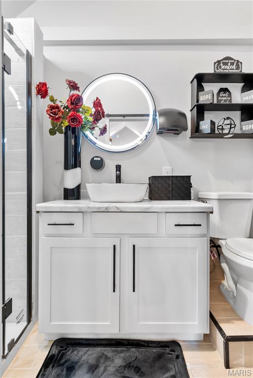 1821 Edwardsville Rd, Madison, IL 62060 - bathroom featuring vanity and a stall shower