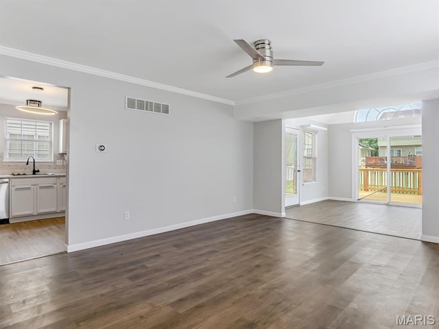 240 Brookmont Dr, Belleville, IL 62221 - unfurnished living room featuring ornamental molding, a ceiling fan, and dark wood-type flooring