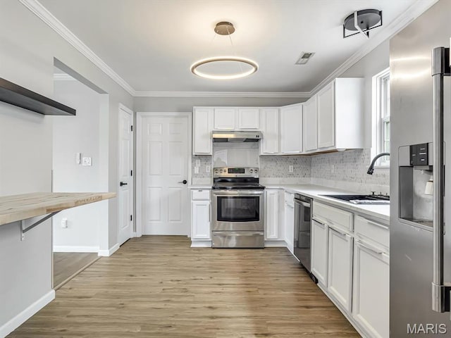 240 Brookmont Dr, Belleville, IL 62221 - kitchen featuring stainless steel appliances, under cabinet range hood, light wood finished floors, light countertops, and white cabinetry