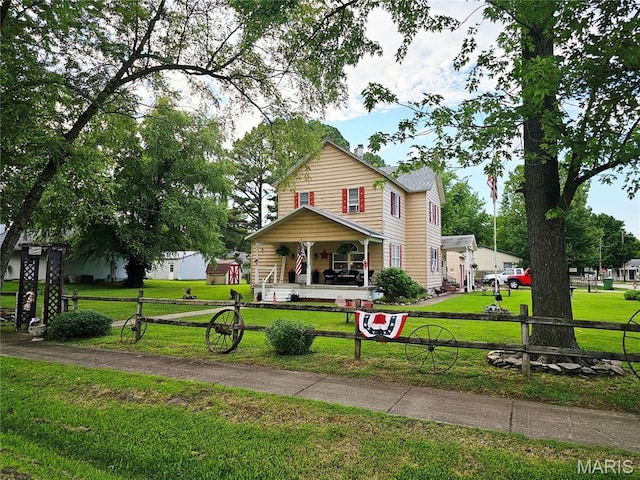 521 Cherry St, Tilden, IL 62292 - traditional-style house with a porch and a front yard