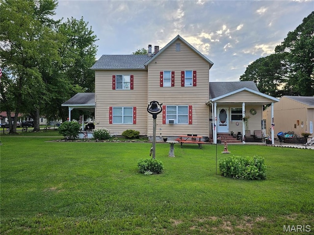 521 Cherry St, Tilden, IL 62292 - traditional-style house featuring a porch, a front yard, and roof with shingles