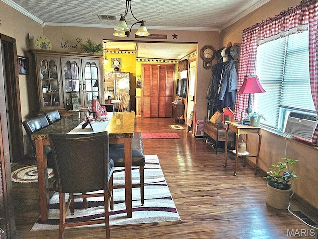 521 Cherry St, Tilden, IL 62292 - dining space featuring wood finished floors, cooling unit, and ornamental molding