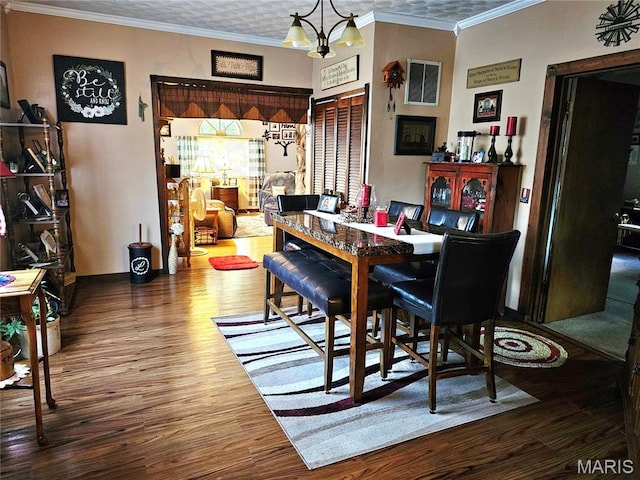 521 Cherry St, Tilden, IL 62292 - dining room featuring wood finished floors, ornamental molding, and a chandelier