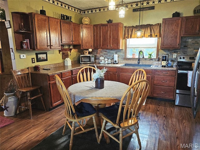 521 Cherry St, Tilden, IL 62292 - kitchen featuring stainless steel appliances, dark wood-style flooring, and tasteful backsplash
