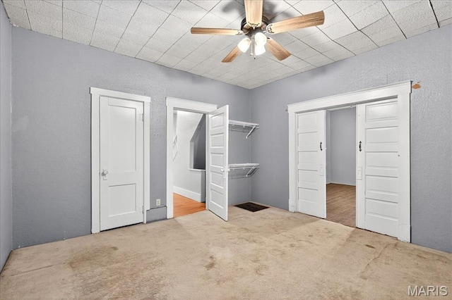 1404 State Route 156, Waterloo, IL 62298 - unfurnished bedroom featuring a textured wall, carpet floors, and ceiling fan