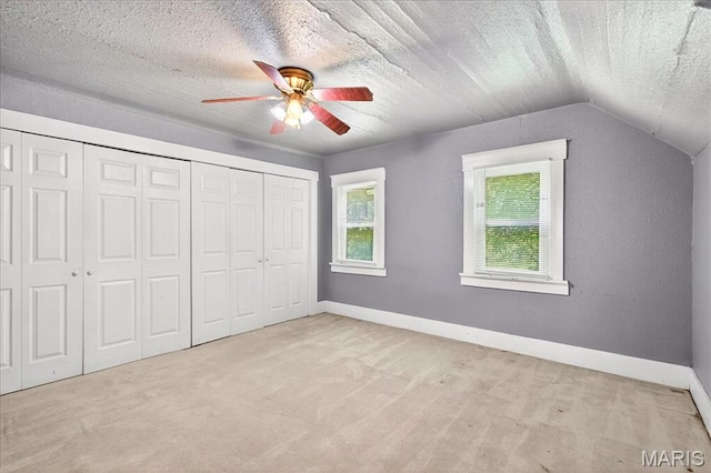 1404 State Route 156, Waterloo, IL 62298 - unfurnished bedroom featuring vaulted ceiling, carpet floors, a closet, a textured ceiling, and ceiling fan