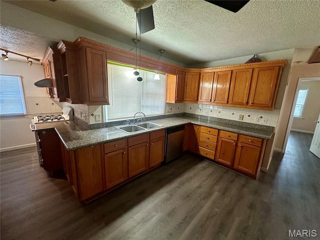 3418 Eastridge Ln, Saint Louis, MO 63074 - kitchen featuring stainless steel dishwasher, a textured ceiling, brown cabinets, and dark wood-style flooring