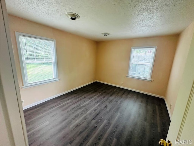 3418 Eastridge Ln, Saint Louis, MO 63074 - unfurnished room with a textured ceiling and dark wood-style floors