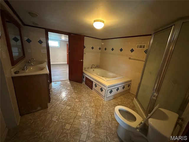 3418 Eastridge Ln, Saint Louis, MO 63074 - full bathroom with a jetted tub, a shower stall, double vanity, and stone finish floors