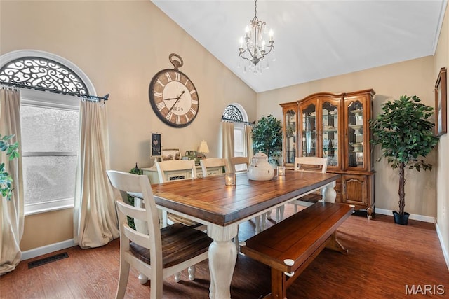 34 Windermere Dr, Glen Carbon, IL 62034 - dining space with a chandelier, high vaulted ceiling, and wood finished floors