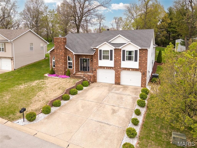 34 Windermere Dr, Glen Carbon, IL 62034 - view of front of property featuring brick siding, an attached garage, concrete driveway, and a chimney