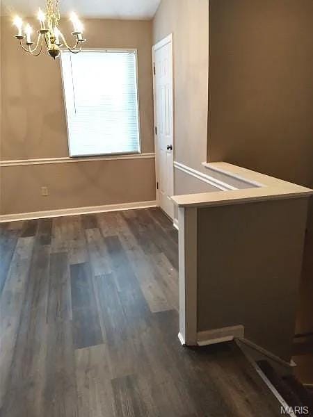 1446 Bluebird Ter, Saint Louis, MO 63144 - interior space with a chandelier and dark wood-style flooring