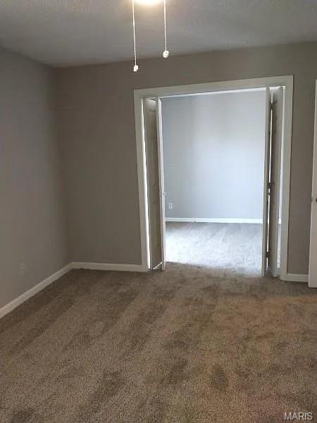1446 Bluebird Ter, Saint Louis, MO 63144 - empty room with carpet floors