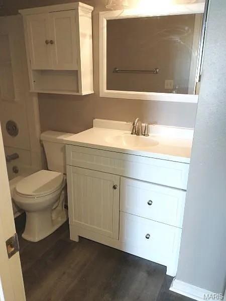1446 Bluebird Ter, Saint Louis, MO 63144 - bathroom featuring vanity and wood finished floors