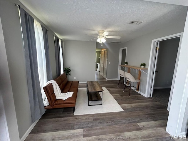 239 N Center St, Sullivan, MO 63080 - living area with ceiling fan, a textured ceiling, and wood finished floors
