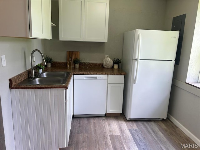239 N Center St, Sullivan, MO 63080 - kitchen with white appliances, light wood finished floors, white cabinetry, and dark countertops