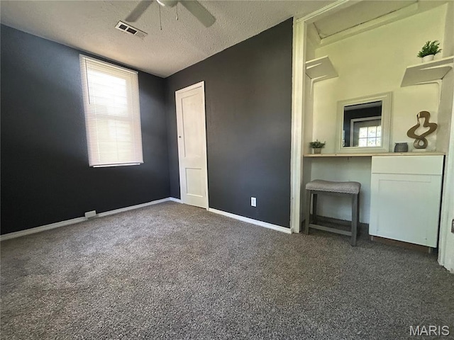 239 N Center St, Sullivan, MO 63080 - unfurnished bedroom featuring attic access, carpet flooring, a textured ceiling, and a ceiling fan