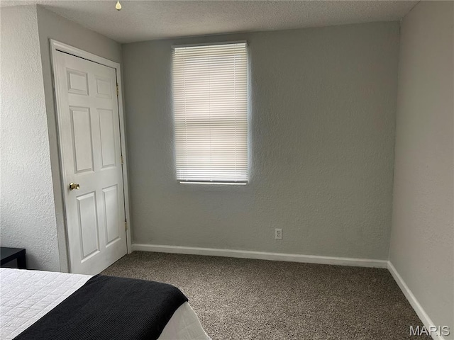239 N Center St, Sullivan, MO 63080 - carpeted bedroom featuring multiple windows and a textured ceiling