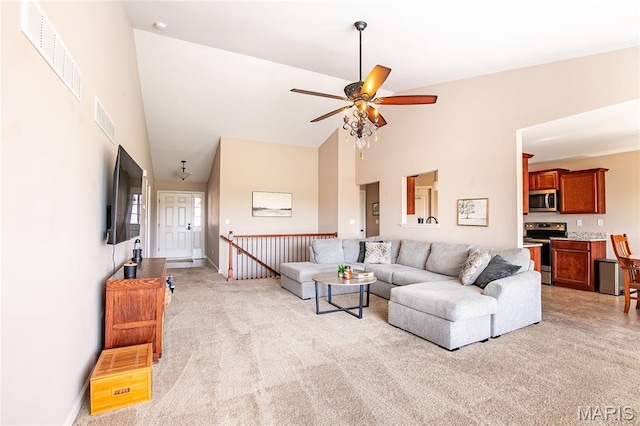 27492 Forest Ridge Ct, Warrenton, MO 63383 - living area featuring light carpet, high vaulted ceiling, and ceiling fan