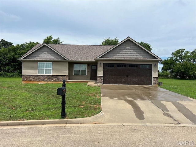445 N Haven Dr, Farmington, MO 63640 - view of front of house featuring a garage, stone siding, a front yard, and concrete driveway