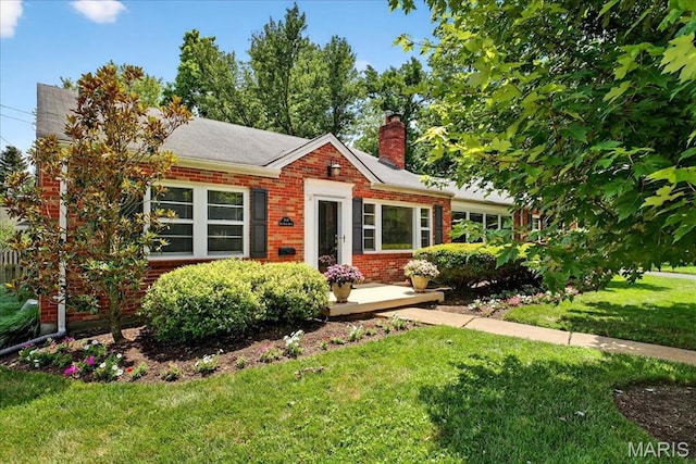 8548 Big Bend Blvd, Webster Groves, MO 63119 - view of front of house featuring brick siding, a front lawn, and a chimney