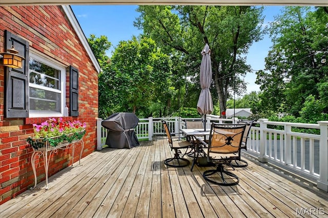 8548 Big Bend Blvd, Webster Groves, MO 63119 - deck featuring outdoor dining space, area for grilling, and view of wooded area