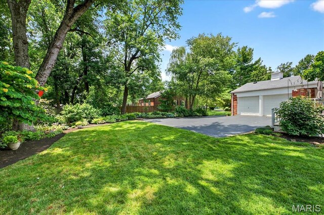 8548 Big Bend Blvd, Webster Groves, MO 63119 - view of grassy yard with a garage