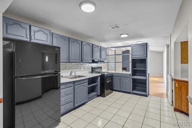 12 Country Ln, Florissant, MO 63033 - kitchen featuring black appliances, open shelves, gray cabinetry, light countertops, and light tile patterned floors