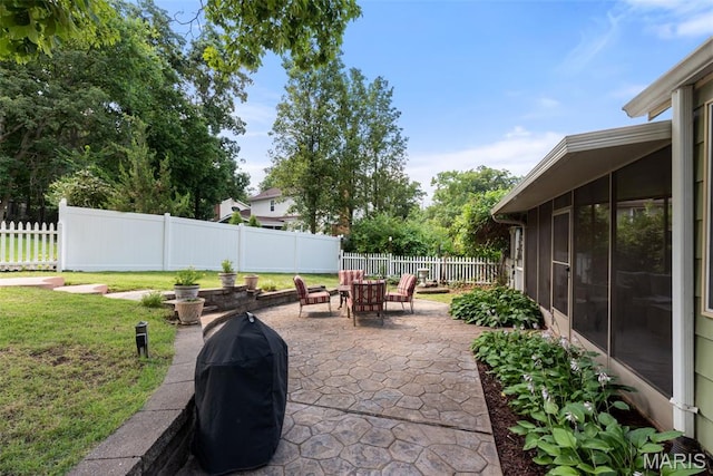 178 Spring Leigh Ct, Ballwin, MO 63011 - fenced backyard with grilling area, a patio area, and a sunroom