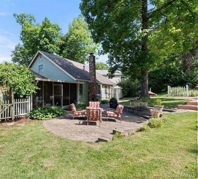 178 Spring Leigh Ct, Ballwin, MO 63011 - back of property with a patio, a sunroom, a chimney, and a shingled roof