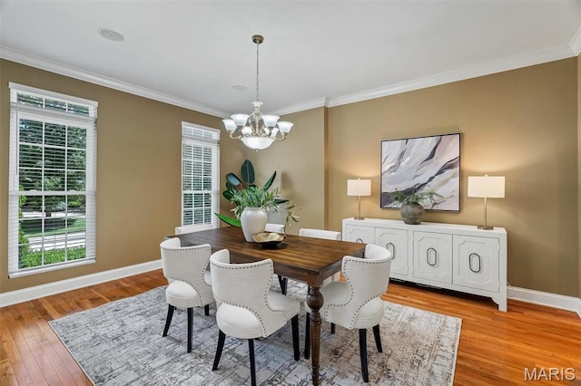 1011 Hawks Landing Dr, Lake St Louis, MO 63367 - dining space featuring a chandelier, light wood-type flooring, and ornamental molding