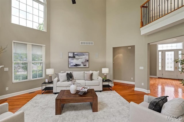 1011 Hawks Landing Dr, Lake St Louis, MO 63367 - living room with a high ceiling, healthy amount of natural light, and wood finished floors
