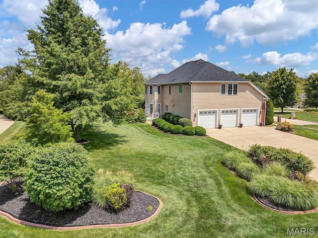 1011 Hawks Landing Dr, Lake St Louis, MO 63367 - view of side of home featuring driveway and a yard