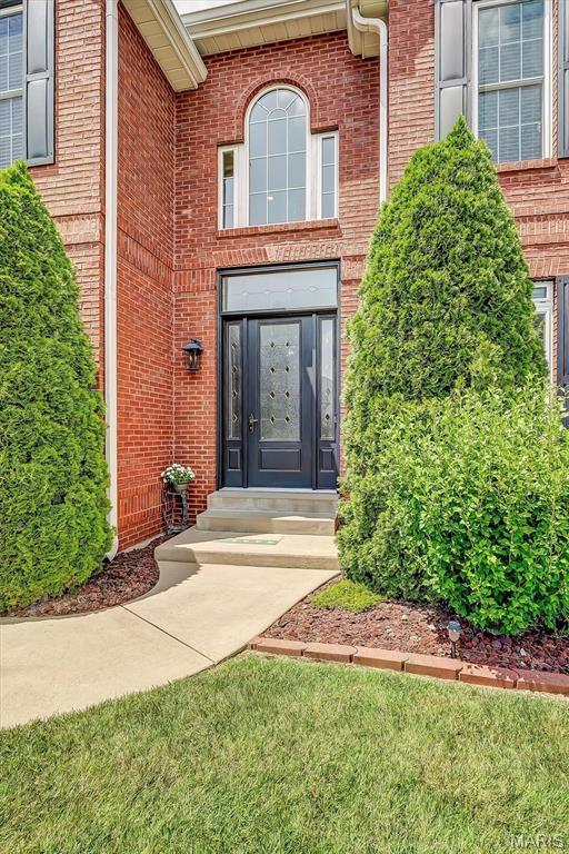 1011 Hawks Landing Dr, Lake St Louis, MO 63367 - doorway to property featuring brick siding