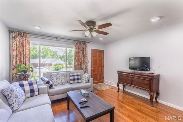 7373 Marwinette Ave, Saint Louis, MO 63116 - living area with a ceiling fan and light wood finished floors