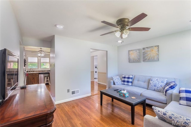 7373 Marwinette Ave, Saint Louis, MO 63116 - living area featuring a ceiling fan and wood finished floors