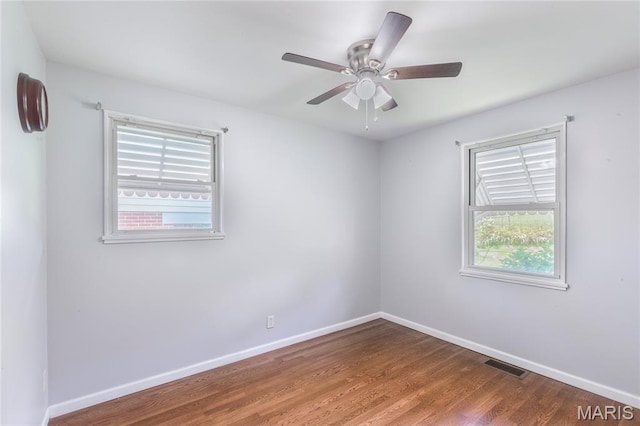 7373 Marwinette Ave, Saint Louis, MO 63116 - spare room with wood finished floors and ceiling fan